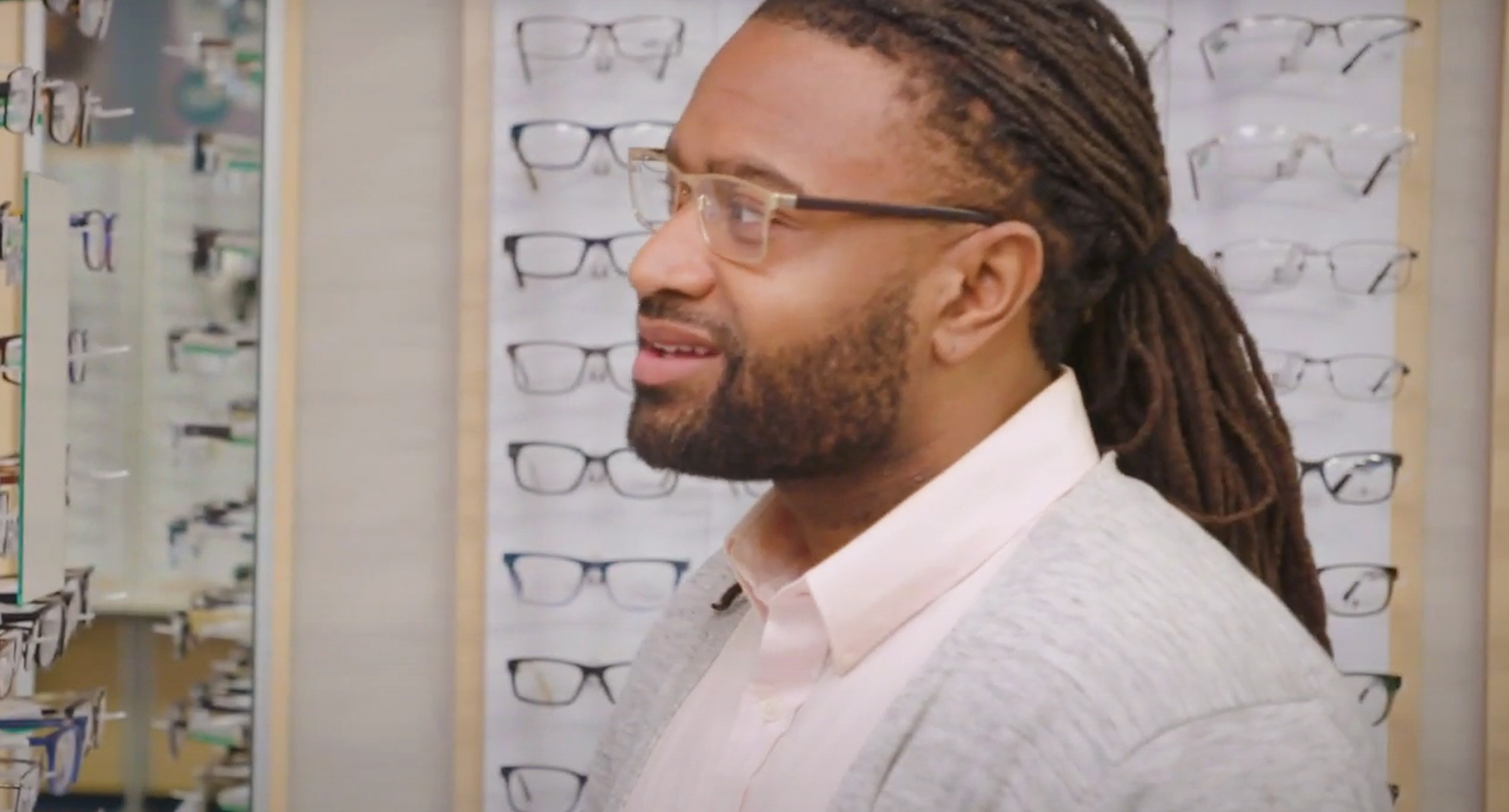 Man standing at glasses display