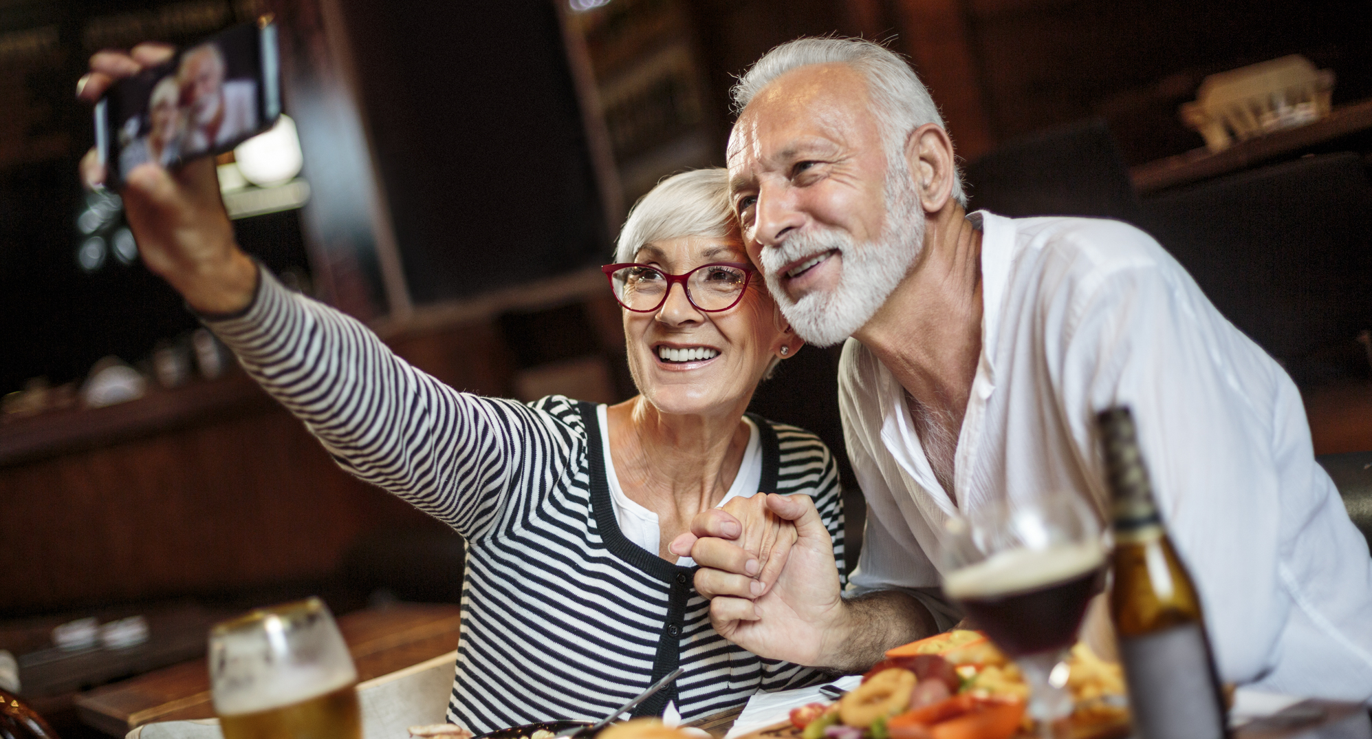 older couple taking a selfie